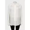 Beige blouse with ruffles