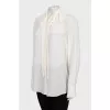 Beige blouse with ruffles