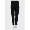 Elastic trousers with silver buttons