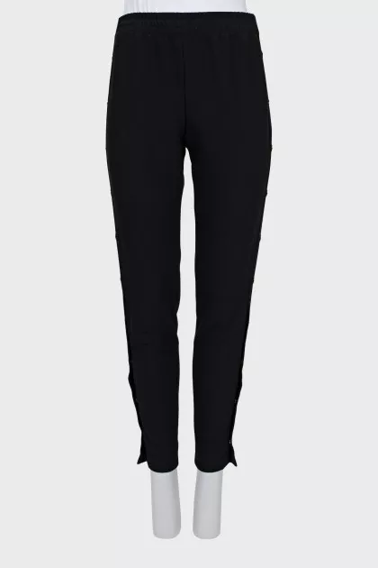 Elastic trousers with silver buttons
