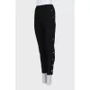 Elastic trousers with silver buttons