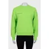 Green sweatshirt with text print