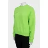 Green sweatshirt with text print