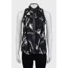 Sleeveless blouse with leather inserts