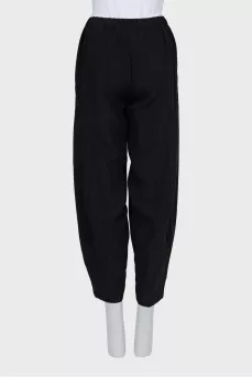 Black tapered trousers with elastic