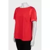 Red blouse with short sleeves