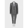 Suit with trousers in checkered print