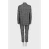 Suit with trousers in checkered print