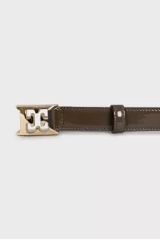 Patent leather belt with gold buckle