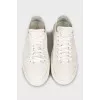 White sneakers with embossed leather