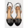 Black leather sandals with metallic decor