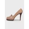 Patent leather high heel shoes