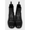 Black leather boots with perforations