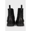 Black leather boots with perforations