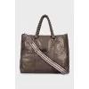 Leather travel bag with woven handles