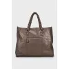 Leather travel bag with woven handles