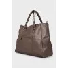 Leather travel bag with woven handles