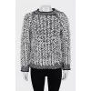 Knitted sweater decorated with buttons
