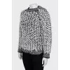 Knitted sweater decorated with buttons