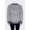 Knitted sweater decorated with buttons