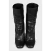 Black snakeskin ankle boots