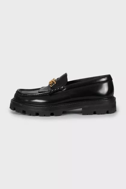 Leather loafers with gold detailing