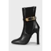 Leather ankle boots with figured heels