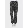 Gray jeans with brand logo