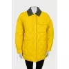 Reversible quilted jacket with tag
