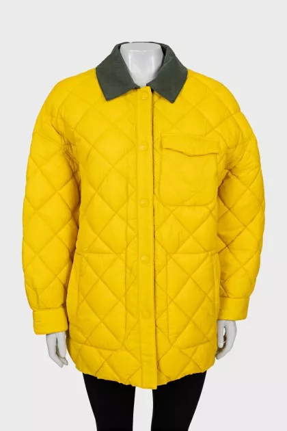 Reversible quilted jacket with tag