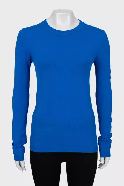 Blue jumper with logo on sleeve