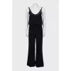 Black jumpsuit decorated with chain