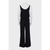 Black jumpsuit decorated with chain