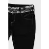 Denim breeches with embellished belt