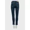 Blue jeans with decorative pockets
