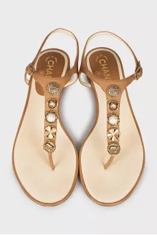 Leather sandals with gold decoration