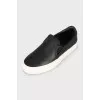 Leather slip-ons with white soles