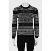 Sweater with perforation and pattern