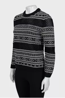 Sweater with perforation and pattern