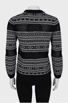 Sweater with perforation and pattern