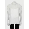 White blouse decorated with rhinestones