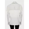 White blouse decorated with rhinestones