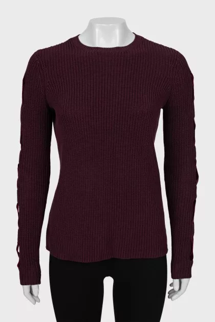 Knitted sweater with decor on the sleeves