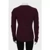 Knitted sweater with decor on the sleeves