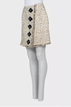Tweed skirt decorated with flowers