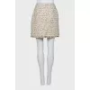Tweed skirt decorated with flowers