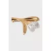 Golden brooch with stones
