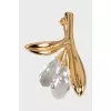 Golden brooch with stones
