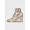 Gold embossed ankle boots