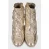 Gold embossed ankle boots